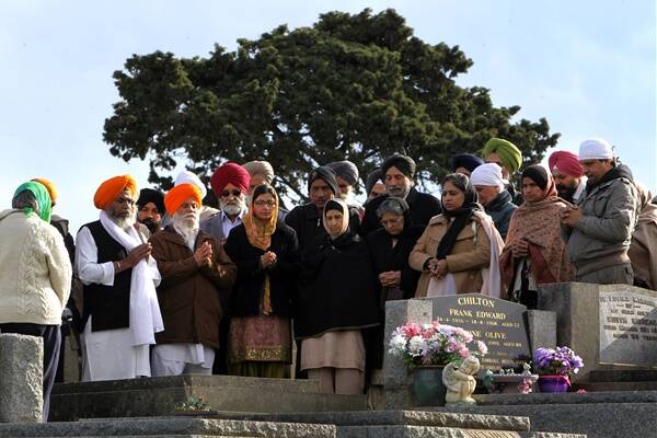 Members of Melbourne's sikh community at yesterday's ceremony for Dolah Singh at Terang cemetery.