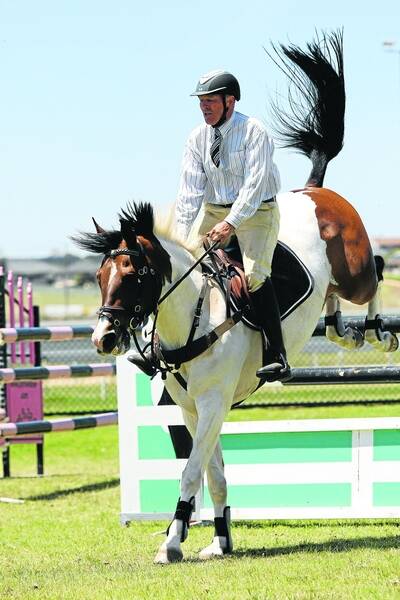Morris Clarke and Contagious clear a jump. PIC: Damian White.