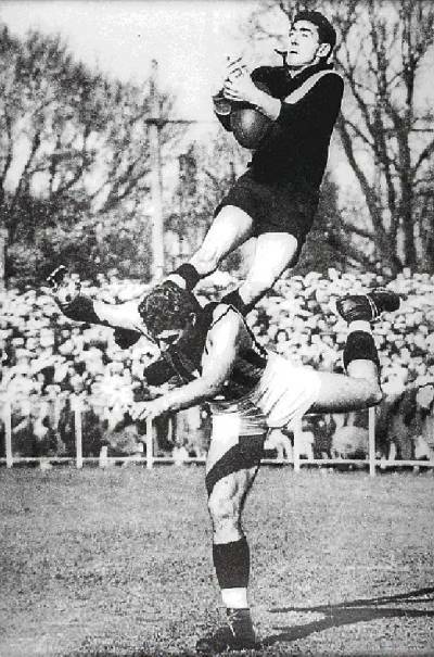 Mark of a champion. South Warrnambool and Richmond great Jack O'Rourke soars over Collingwood full-back Jack Hamilton at Punt Road Oval in 1951 in this famous photo by Ray Blackburn.