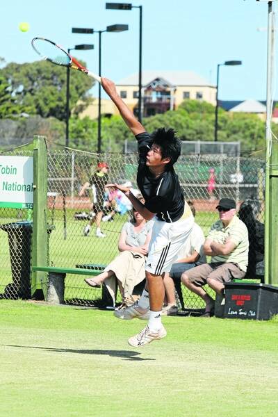 North Ringwood's William Ma, 16,  puts all his effort into this serve at the Warrnambool Junior Grasscourt Open.