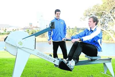 South West Academy of Sports executive officer Glenn Singleton watches on as the academy's first elite athlete Tommy Bertrand goes through his paces at the Nestles Rowing Club yesterday.