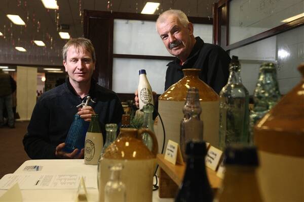 David Wallace (left) and Rex Matthews with their bottles at the Collectabool Fair.