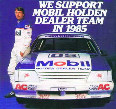 Peter Brock poses with the car in a 1985 advertisement. Brock drove the car to victory at Sandown that year.