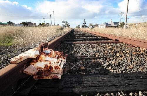 A rusting lock blocks the long-disused rail line near the Dennington railway crossing where a trainspotter was paid to look for trains. 080722GW04 Picture: GLEN WATSON