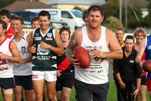 Billy Nicholls joins his teammates for training at South Warrnambool last night.