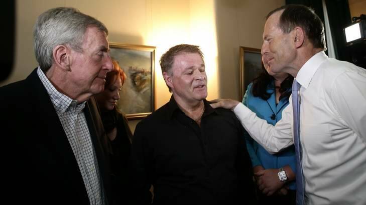Opposition Leader Tony Abbott meets Bali bombing survivors Paul Anicich, left, and Peter Hughes, centre. Photo: Alex Ellinghausen