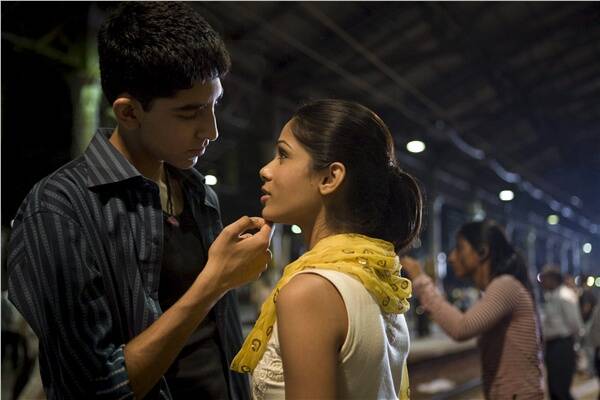 Dev Patel as Jamal Malik and Freida Pinto as Latika in the Oscar-winning
