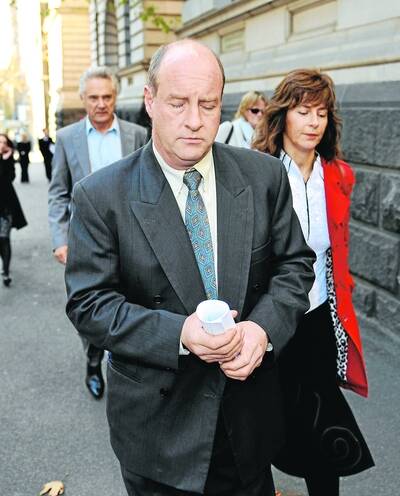 The AgeNews25/06/09picture Justin McManus.David Fitchett leaving the Cort of Appeal where his wife Donna had her conviction for killing their kids overturned.