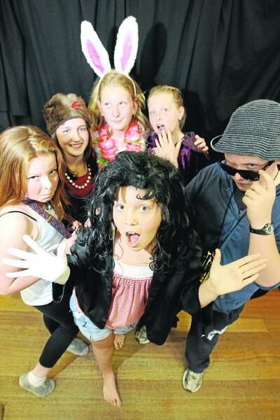 Amelia Monk, 11, takes centre stage with fellow cast members Georgia Hodgetts 11 (left), Molly Grapentin, 11, Giorgina Maxwell, 13, Eva Clark, 11, and Tom Bruckner, 13. 