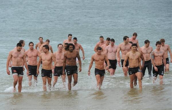 Luke Rounds (centre) joins his Collingwood teammates for a recovery session. Picture: THE AGE