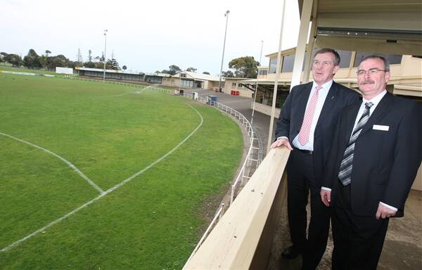 Sports Minister Hugh Delahunty surveys Reid Oval with the council's manager recreation and culture Russell Lineham.