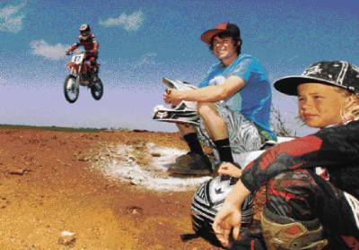 Jack Downing (left) and Austin Patterson sit back as Jake Smith tests the Lake Gillear track for the weekend's racing. Picture: ANGELA MILNE