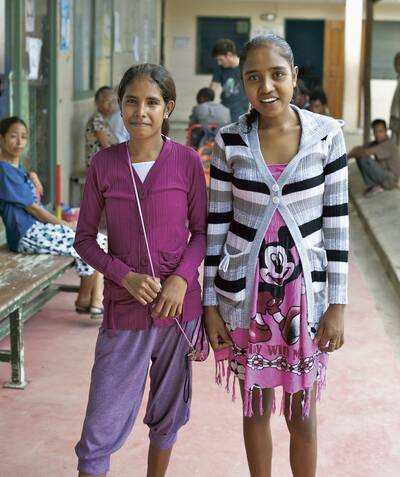 Ursula de Carvalho Soares [left] and Flavia Lucilda Guterres at Bairo Pite Clinic in Dili, East Timor. Both girls are waiting for heart surgery. They both had rheumatic fever when younger which led to damage to the mitral valve in the heart causing mitral stenosis leading to a congestive heart failure. Picture: THE AGE
