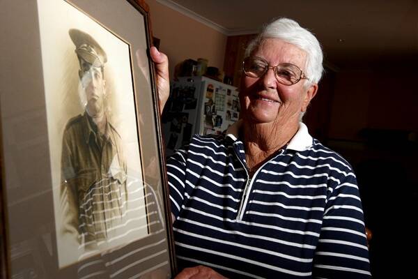 Elaine Fitzgerald holds a picture of her father, WWI soldier Harold Bates, who returned from the war after being shot and spending two years in a POW camp. PIC: Aaron Sawall.