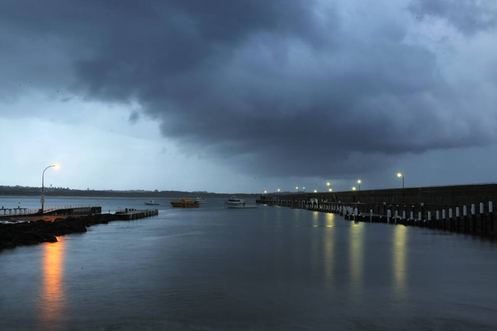Storm clouds over the Breakwater and Lady Bay. 
