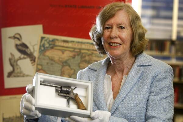 Sue Weekes holds the pistol that explorer William Wills once owned.