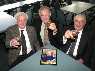 Ken Horspole (left), Geoff Morgan and Robbie Leishman raise their glasses to their mate, Bill Roycroft, who died last Sunday.