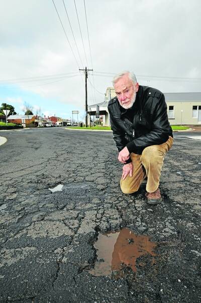 Penshurst resident Gordon McGlashan says the town's road surface has been damaged by trucks carrying scoria to a wind farm at Macarthur. PIC: Alexandra Weaver.