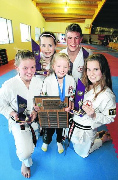 Funakoshi karate members  Phoebe Sloane, left, Victoria Kelly,   Gemma Parsons , Billy Sloane and Ashlee Kelly with the spoils of competition.