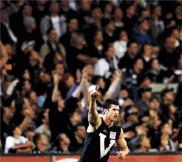 Jonathan Brown celebrates one of his two last-quarter goal in Saturday night's AFL Hall of Fame Tribute Match. Picture: JOHN DONEGAN