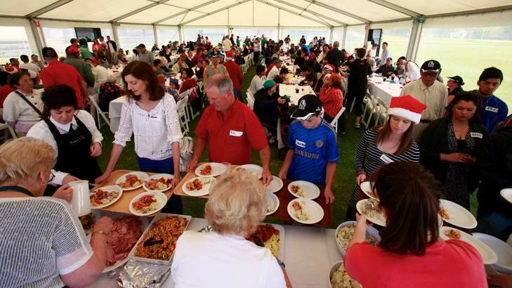 More than pies ... the Collingwood Christmas lunch for the homeless at  Victoria Park.