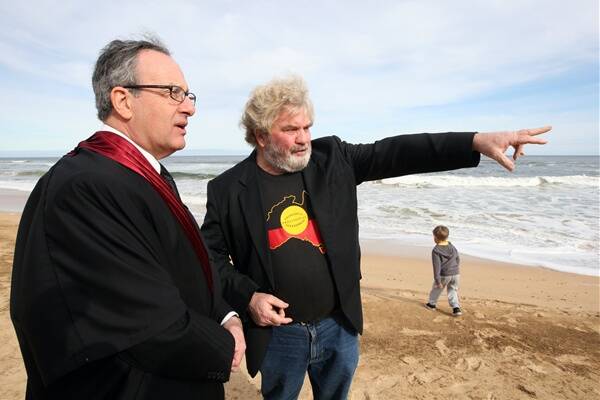 Federal Court Justice Anthony North and Geoff Clark showing him aboriginal sites along the beach at Yambuk.