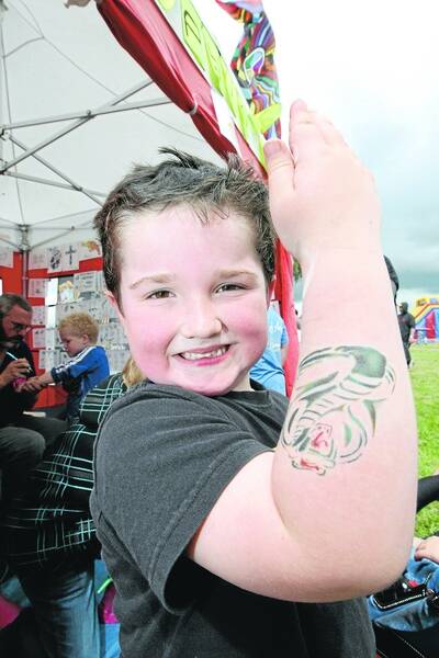 Tyler Newcombe, 5, from Camperdown, shows off his temporary tattoo of a snake.   111008DW13