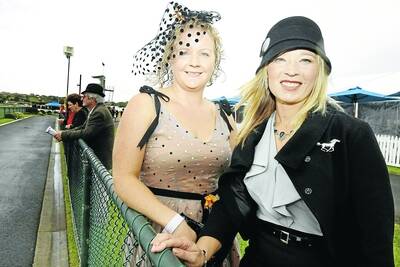 Tabcorp May Racing Carnival Day 1. Pictured - Ladies Lunch, l-r Laura Tweedle, of Warrnambool, and Karin Couch, of Nirranda, at the rail for the next race. 100504RG14 Picture  ROB GUNSTONE SPECIAL 00000000