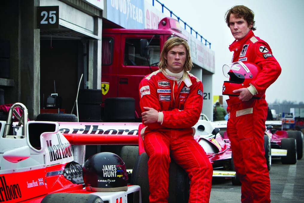 F1 rivals James Hunt (Chris Hemsworth, left) and Niki Lauda (Daniel Bruhl) in a scene from Ron Howard's Rush.  