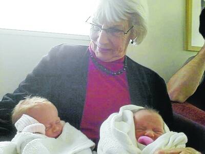 Great-grandmother Patricia Meade holds twins Madeleine Annemarie Isabel and Penelope Therese Annie, who are direct descendents of Irish immigrants Patrick Meade and Margaret Nolan.