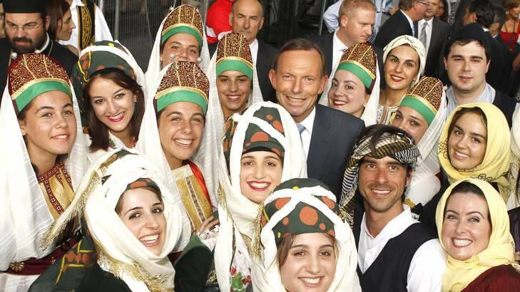 Prime Minister Tony Abbott with greek dancers at the Antipodes Festival on Lonsdale Street. Photo: Wayne Hawkins