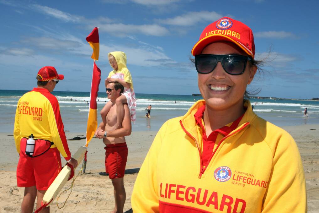 Warrnambool Surf Life Saving Club’s Marli Blackney-Noter hopes beachgoers take care in and around the sea this summer, as fellow lifeguard Jackson Fary greets Norwergian tourist Rolf Boujamin and daughter Marthe, 6. 