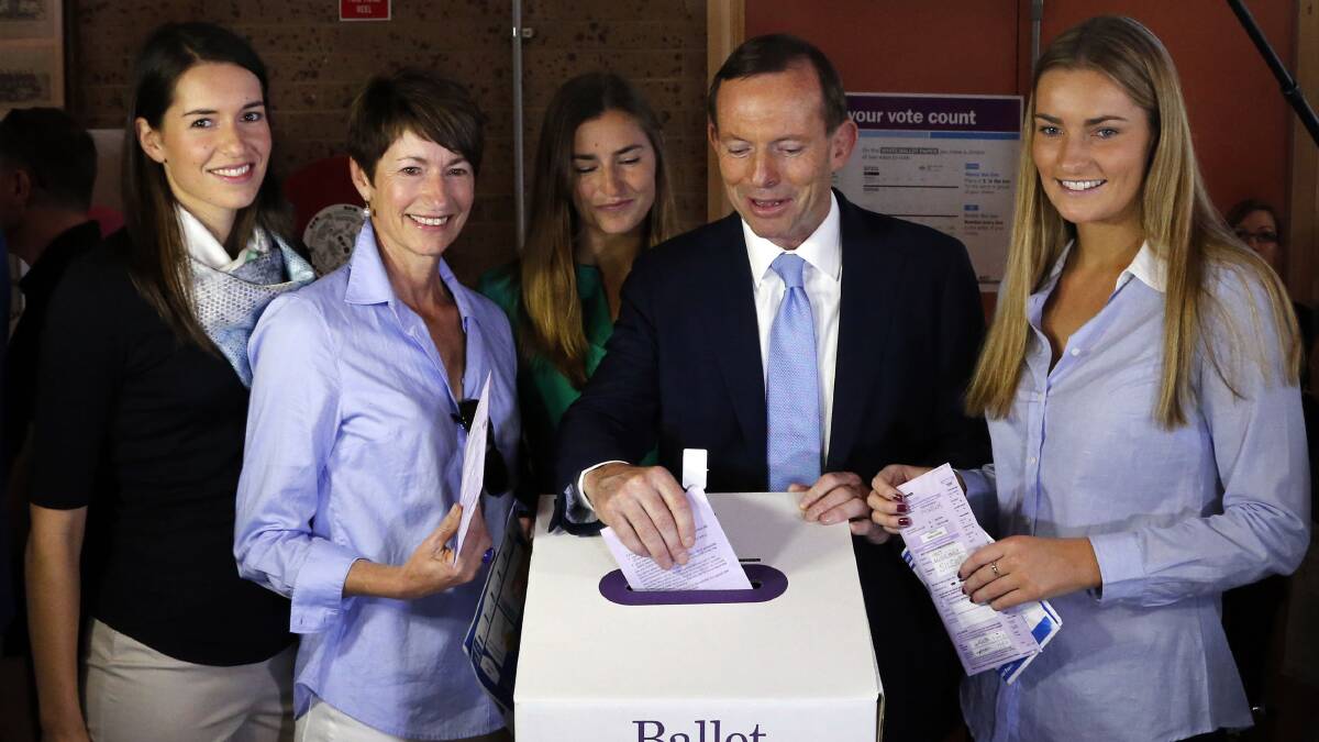 Opposition Leader Tony Abbott casts his vote. Photo: ALEX ELLINGHAUSEN 