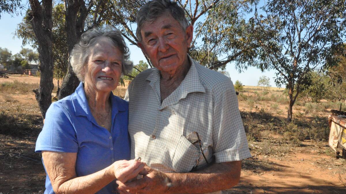 Denise and Laurence Joyce standing at the Wandearah West farm where her engagement ring was found by grandson Daniel recently.