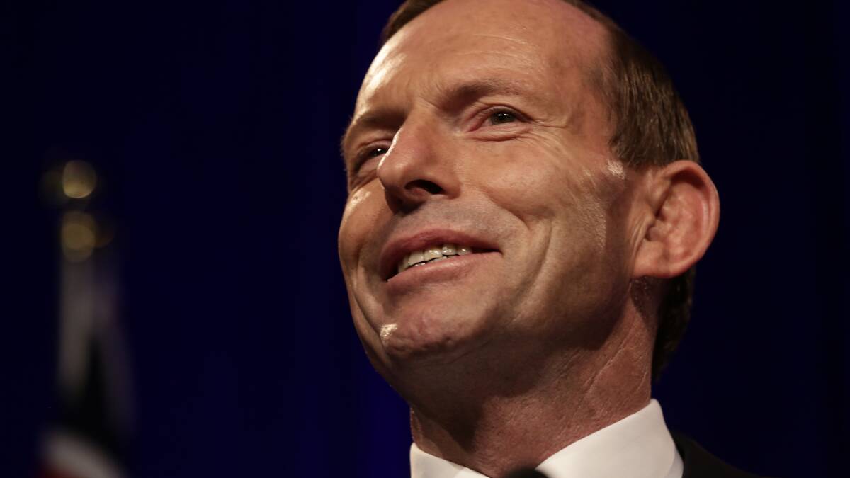 Prime Minister-elect Tony Abbott accepts victory at Sydney's Four Seasons Hotel. Photo: ALEX ELLINGHAUSEN