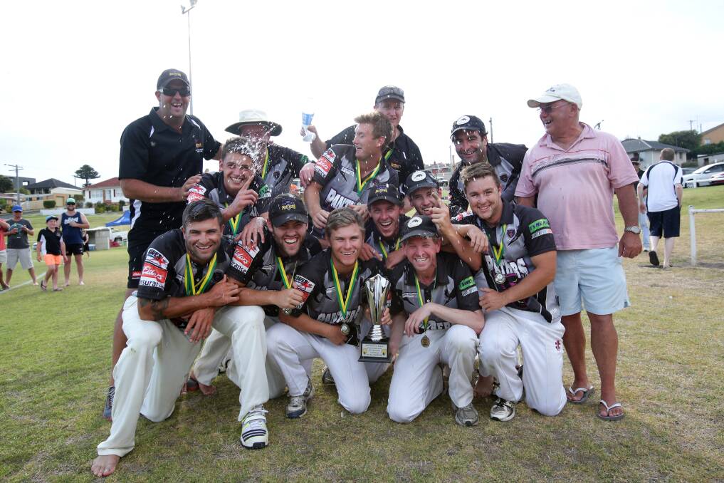 West Warrnambool players celebrate their title-winning victory over Allansford yesterday. 