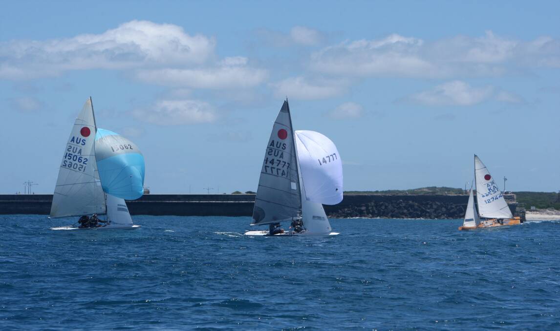 Fireball International Australian title leader Kiss (centre), skippered by Michael Thomson, in racing action off Warrnambool. 