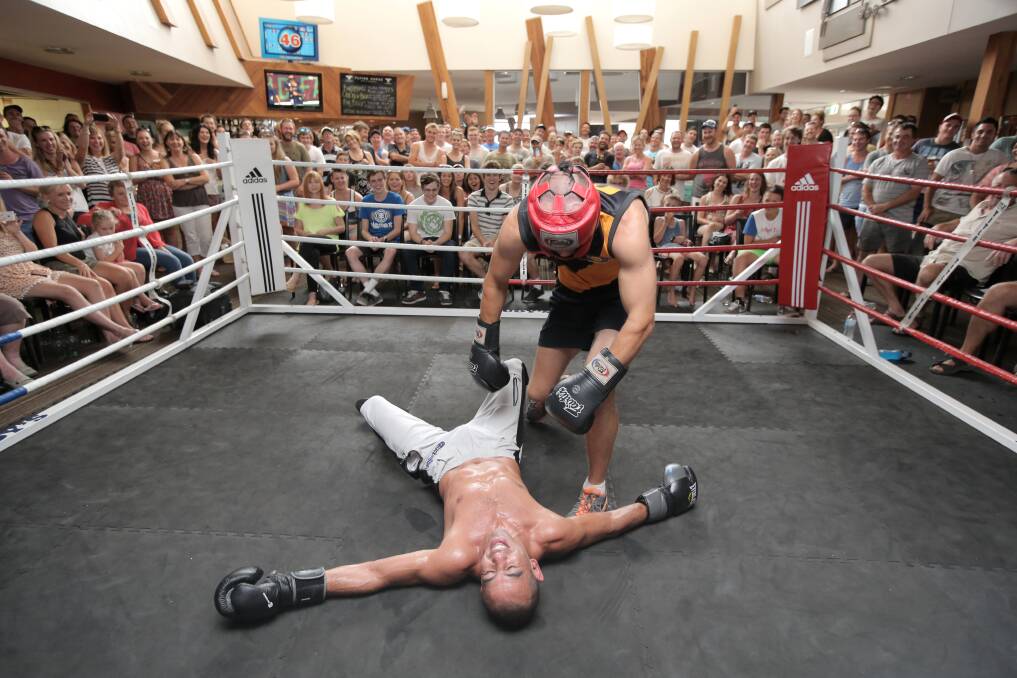 Merrivale footballer Joe Woonton puts Sam Soliman on the canvas during one of the sparring bouts. 