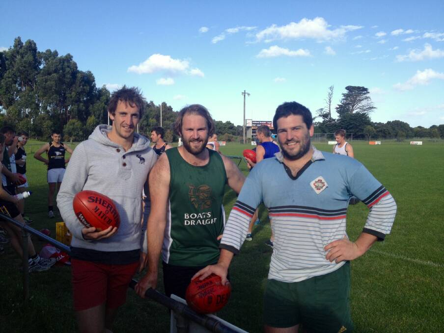 Fremantle footballer Michael Barlow (left) at North Warrnambool Eagles’ training on Wednesday with brothers Herb and Dom.