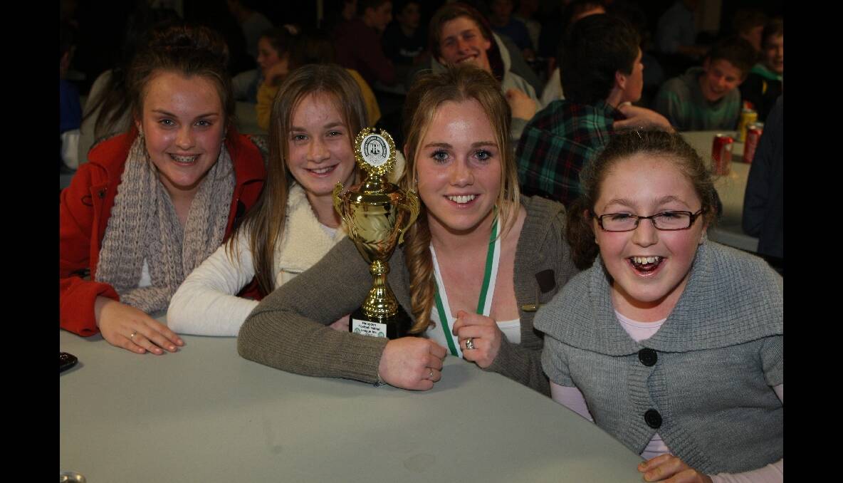 Rachael Earls (second from right) celebrates her award win with teammates Rachel O'Connor (left), Olivia Ludeman and Courtney Earls.