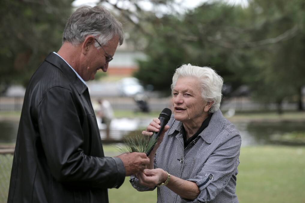 Lindsay McDowell, grandson of Keith McDowell who brought home the original Gallipoli pine cone, accepts a seedling from Friends of the Botanic Gardens president Pat Varley.
