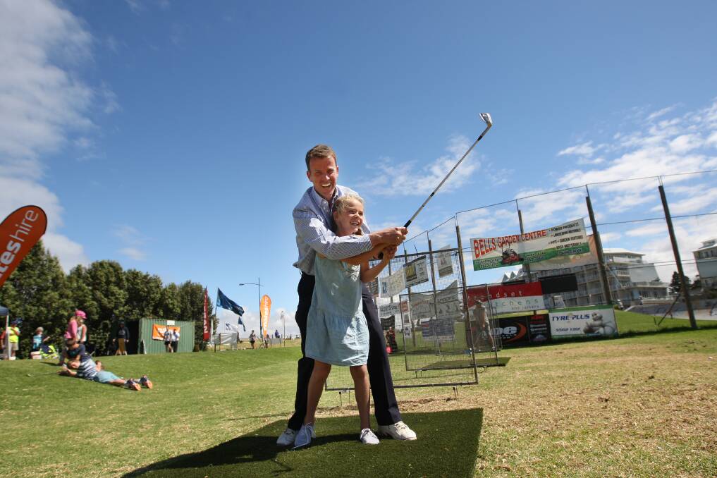 Wannon MP Dan Tehan and his daughter Maya, 9, try their luck at Rotary’s Warrnambool hole-in-one competition. The competition expects to raise $40,000 for worthy projects.