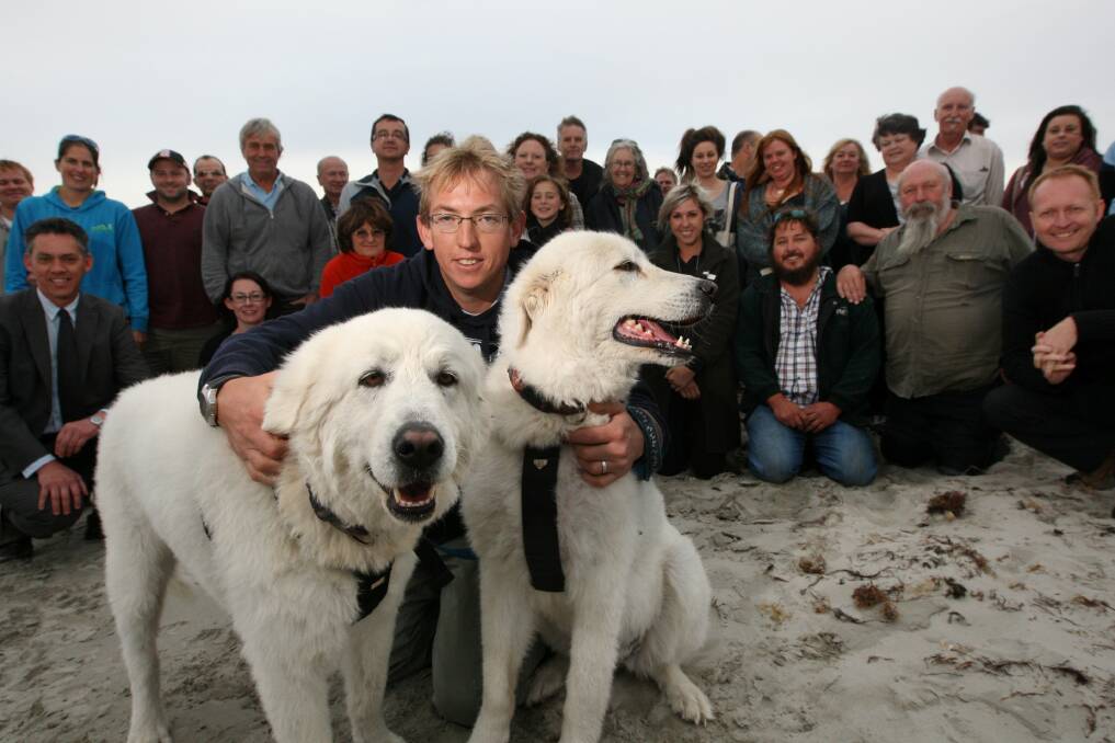 Middle Island Maremma Project supporters celebrate the project’s success with Warrnambool City Council environment staffer Justin Harzmeyer and pooches Tula and Eudy. 