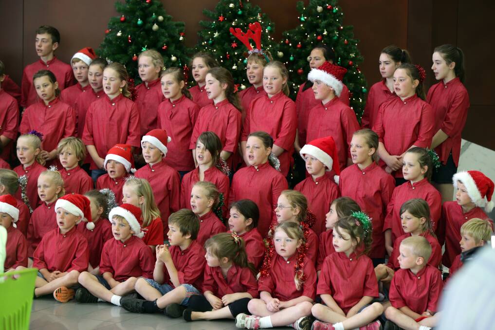 The Mortlake P-12 College choir sing at the Warrnambool Base Hospital foyer yesterday.
