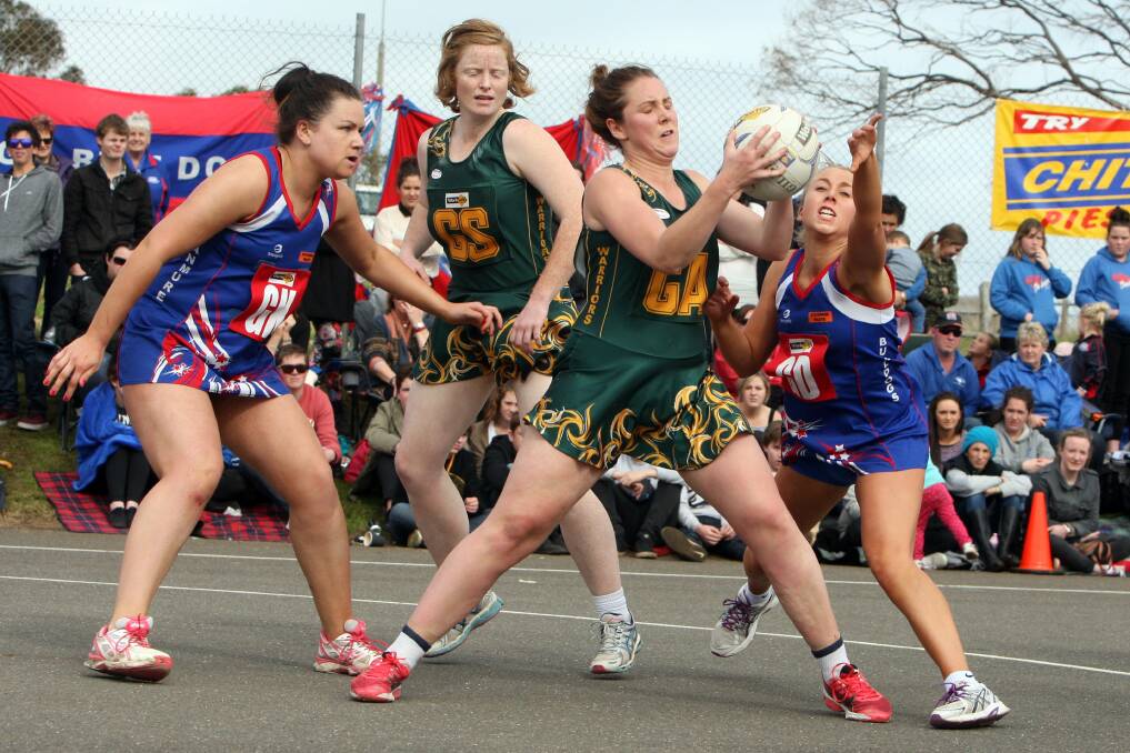 Old Collegians’ Sophie Ballinger (holding the ball) has been named in the Warrnambool and District squad for the 2014 Western Regional State League competition.