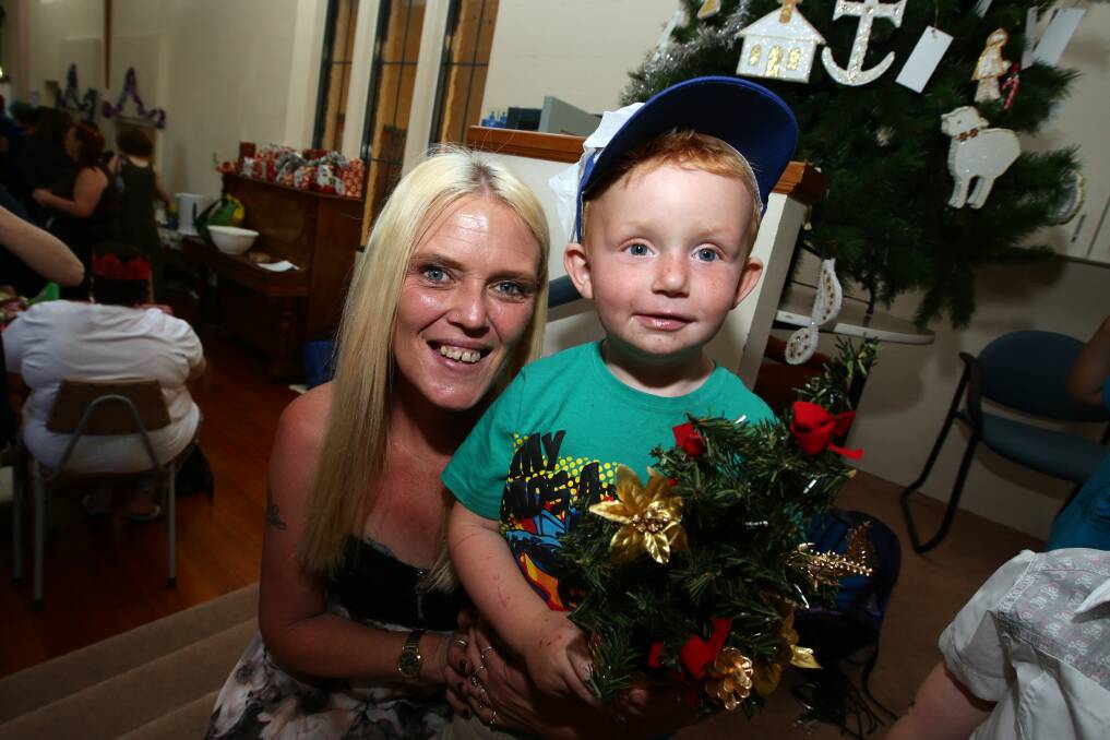 Kristie Kelp with son Blake Gibson, 3, who has just returned home after cancer treatment in Melbourne, get into the festive spirit at the Christmas lunch. 