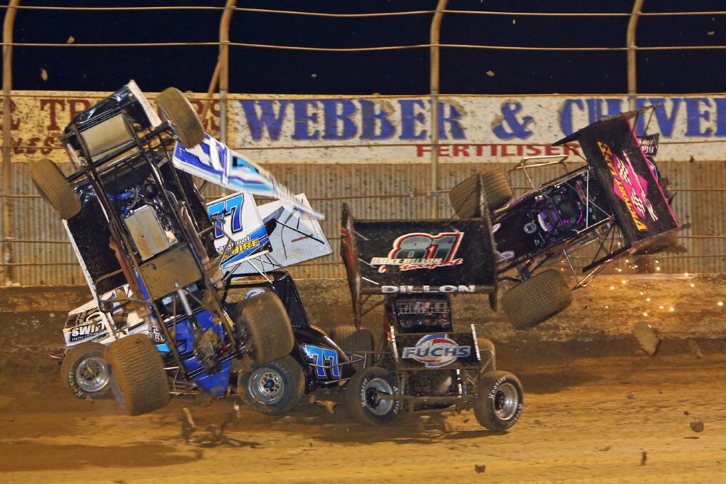 The cars of Jason Johnson (NQ47, vertical), Darren Mollenoyux (V77), Luke Dillon (S81) and Stephen Bell (V88, right) crash during World Series Sprintcars round five at Premier Speedway on New Year’s Day. 