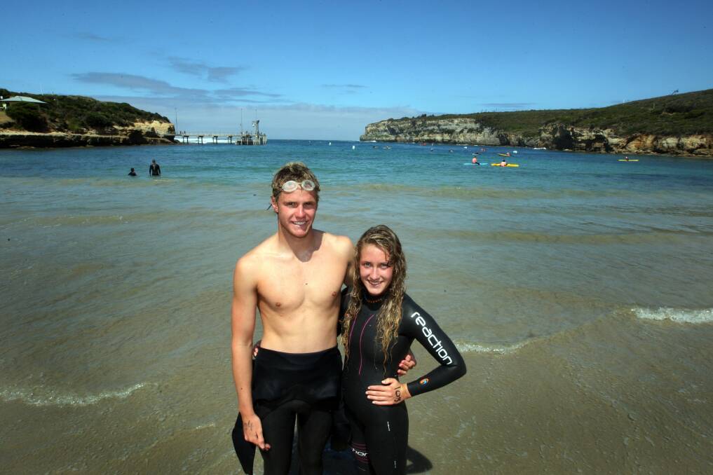 Warrnambool’s Isaac Jones and Brittney Berger, both 17, celebrate their series wins after taking out the overall male and female honours in yesterday’s 12 Apostles Plunge.