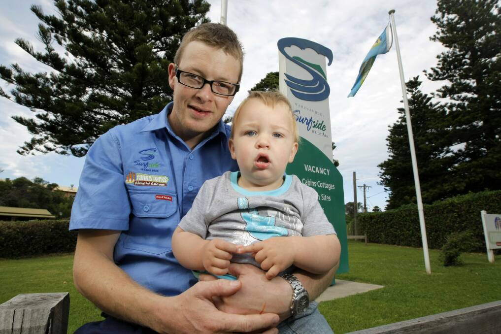 New Surfside Holiday Park manager Alex Reardon with his 16-month-old son Lachlan. 