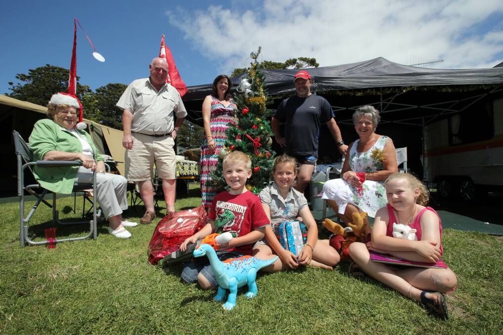 Gathering around the Christmas tree at Port Fairy’s Gardens Caravan Park are (back from left) Beth Grant, Robert Grant, Amanda Castle, Barry Castle, Virginia Grant and (front) Lucas, 4, Imogen, 8, and Gemma Castle, 6.